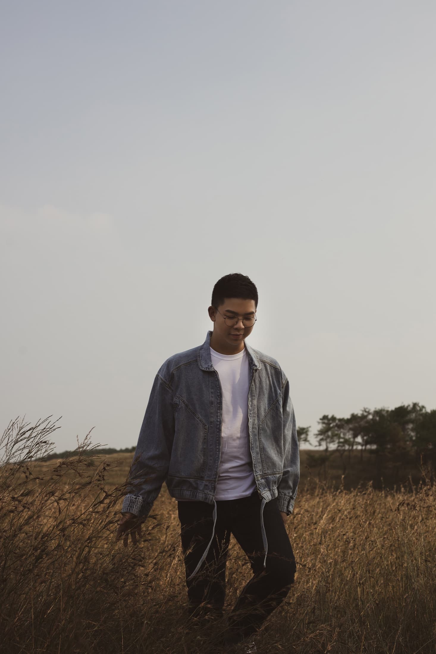Tonny Yao standing in an open Australian landscape